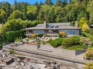 Thoughtfully designed for seamless indoor-outdoor living, the home features expansive waterfront patios, lush grounds and an ambiance of tranquility and sophistication.