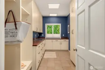 The mudroom offers tons of workspace and storage options for those Costco runs, while conveniently located adjacent to the 2-car garage.