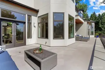 Looking towards the south end of the deck, the entire deck offers expansive vantage points to the Western views. Imagine the sunsets you will enjoy from this pristine home!