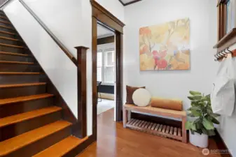 Beautiful entry way showcasign the original FIR wood floors