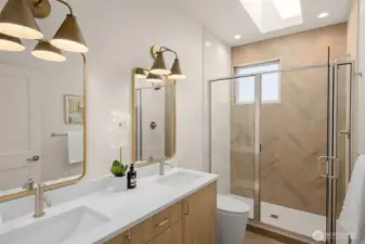 Modern 3/4 bath with premium fixtures and dual vanities.