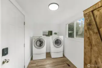 Laundry room with inviting barn doors