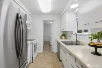 Kitchen has double door fridge.