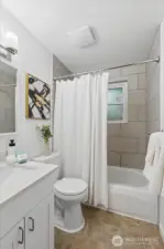 Bath has new flooring, new window and toilet.