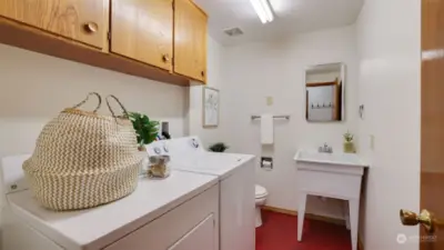 Utility room has a large basin sink.