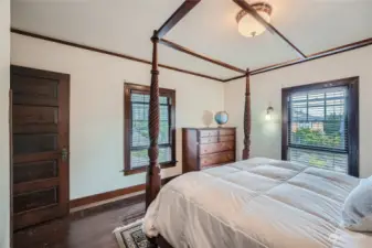 More wood-wrapped window in the upper floor bedroom