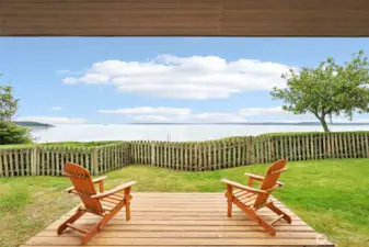 A covered porch runs the length of the house - enjoy the birds, the water traffic, the views, the beauty.