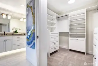 Primary walk in closet is built out with custom build outs as are all closets in the home!