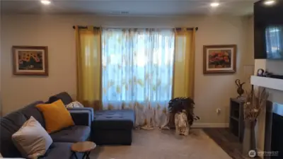 The living room has a gas fireplace