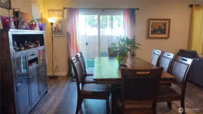 There is plank flooring in the dining room, kitchen, living room and front entry.