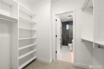 Expansive walk-in closet in the primary suite with built-in organization.