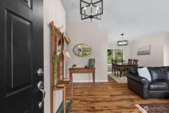 Vaulted ceilings adorn the entry into the home, with a sitting area and formal dining space. It's all a flex space to use as your heart desires!