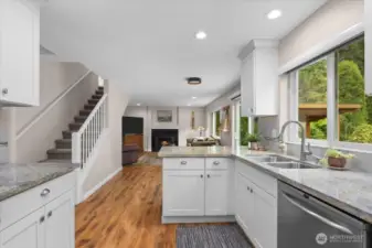 Functional kitchen space with peninsula. Perfect for your charcuterie spread and appetizers when hosting!