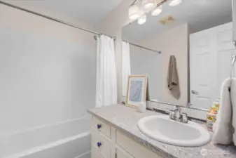 Upstairs guest bathroom with shower & tub
