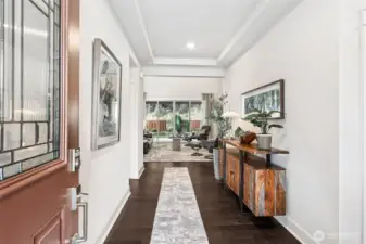 Step inside to a grand and open entryway.  With a view to the back yard.