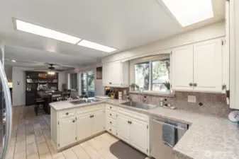 The kitchen offers sleek stainless appliances, granite countertops, and connectivity to guests in the informal dining area as well as access to outdoor entertaining.Tile floors and stylish hardware accents complete this beautiful & functional kitchen.