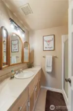 Full guest bathroom located off of the family room.