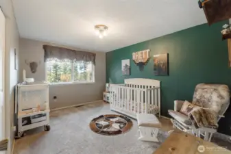 Down the hall find the first of three additional spacious guest rooms.