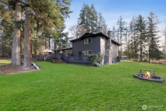 The backyard is an intimate space to relax and enjoy smores at the firepit.