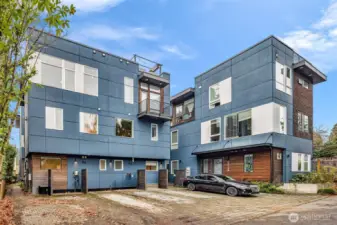 Far Left Corner (split that building into two units 9732-A is the full Southern half) deeded parking is in the middle, with EV.