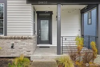 The charming front patio is the perfect spot to enjoy morning coffee or unwind at the end of the day.