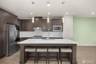 An inviting eat-in kitchen with a spacious dining area, seamlessly blending functionality and comfort for casual meals and gatherings.