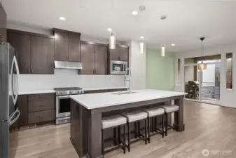 An inviting eat-in kitchen with a spacious dining area, seamlessly blending functionality and comfort for casual meals and gatherings.