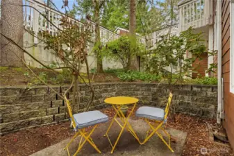 The stairs to your home. While a lower level might seem inferior, it creates privacy. Your front windows open to a private patio, not a parking lot or other units.