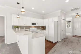 Lovely kitchen w/updated counters, backsplash and lighting