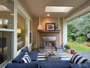 Covered back deck with propane fireplace and skylights; Landscaped for privacy