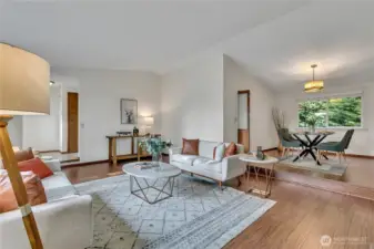 View of entryway, living room, and dining room