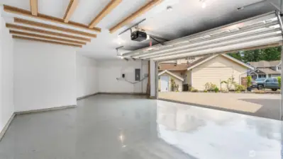 The sleek epoxy floor in the garage is a total game changer - durable, easy to clean, and giving off major showroom vibes. It’s not just practical, it elevates the whole space and makes even your garage feel polished and put together.