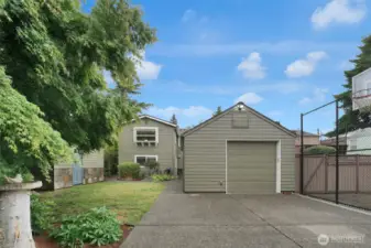 Paved alley access to 2 parking spaces and garage