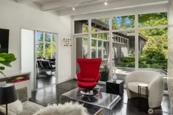 The sunroom door opens to the outdoor patio, the east facing garden
