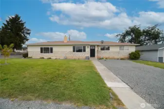 Second front view of this ranch style home with updated landscaping,windows and large driveway