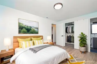 Good sized virtually staged primarty bedroom with walk in closet