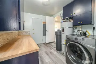 Here is good sized laundry room off bonus room and back bedrooms with newer appliances and whole house water softner