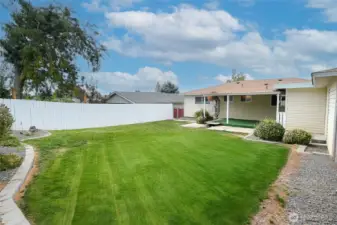 Check out this large flat nicely landscaped yard big enough for all you back yard activities