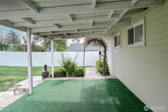 Wonderful covered back patio to stay cool and warm under