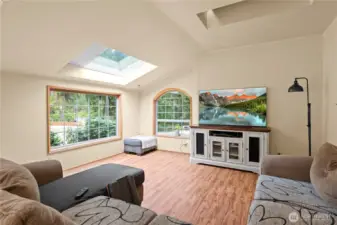 Large windows gather in the views of the back yard, a lovely family room for creating memories for a lifetime!