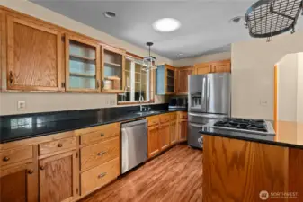 Granite countertops, updated stainless steel appliances (new fridge & dishwasher) and solid wood cabinets in this expansive kitchen!