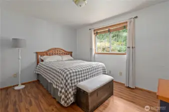 Bedroom two with custom blinds and view to the lovely back yard. See virtual tour link with 3D walkthrough video and interactive floorplans.