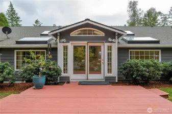 Gorgeous back deck, with lovely French doors leading to the sunroom.