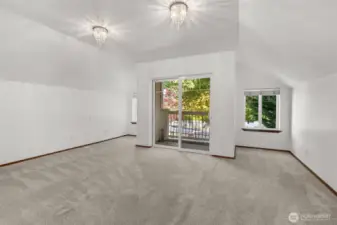 Bedroom 3 suite w/balcony and vaulted ceilings.