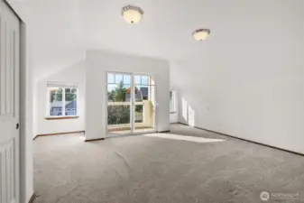 Bedroom 4 w/balcony and vaulted ceilings.