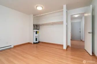 Water heater tucked in the primary closet to maximize floor space.