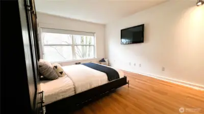 Easy to care for laminate plank flooring flows through the main room and hallway.