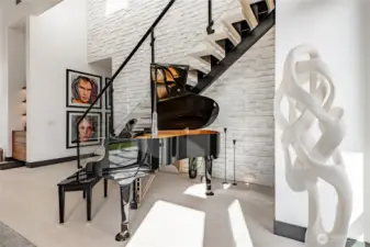 Baby grand piano as you enter the home.