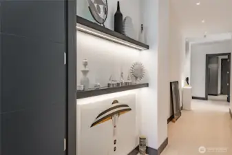 Hallway from primary bedroom towards guest bedroom and into the laundry room and garage.