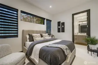 Guest bedroom with ensuite bath and blackout blinds.